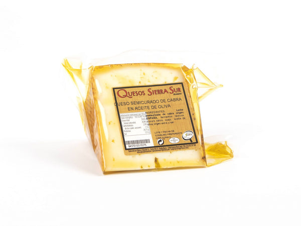 Semi-cured goat cheese wedge in oil