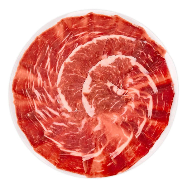 Dishes of 100% Iberian Acorn-Fed Ham Sliced ​​with a Knife 