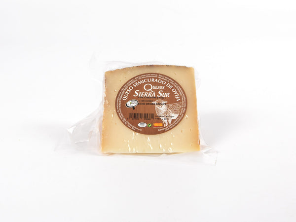 Semi-cured sheep's cheese wedge
